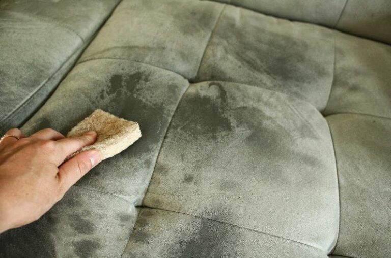 A close-up of fabric being cleaned to remove mold using natural remedies