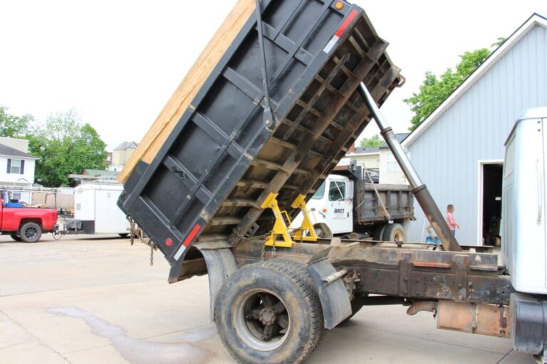 a dump truck with a raised bed.