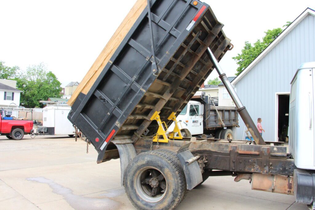 a dump truck with a raised bed.