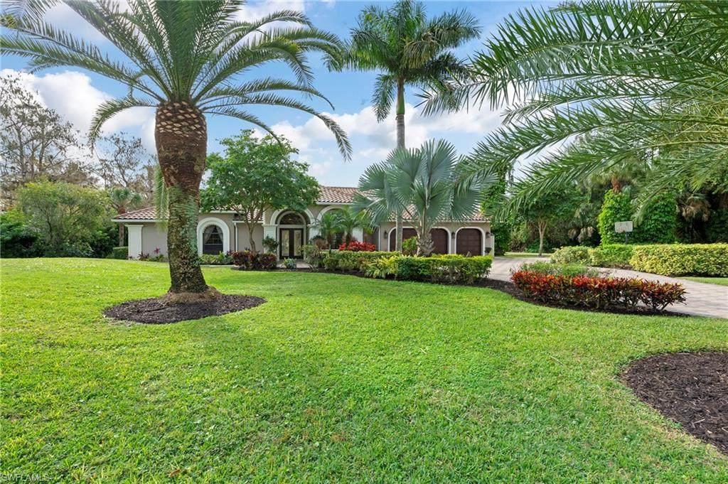 a home in Golden Gate Estates with a lawn