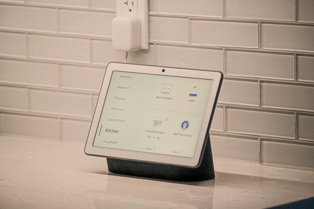 A white tablet showing settings for maintaining lighting, thermostat, etc.