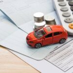 toy-car-with-money-and-calculator-article-image