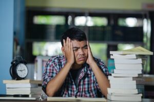 educational-conept-tired-student-library (1)
