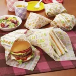 Which Layout Techniques Enhance Custom Sandwich Paper Appeal?