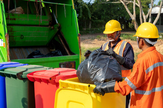 Professional workers handling garbage bins during Waste removal services Kent WA, ensuring efficient waste collection, sorting, and eco-friendly disposal with proper safety gear and recycling practices.