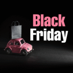 Pink toy car carrying a shopping bag with Black Friday sale text on dark background