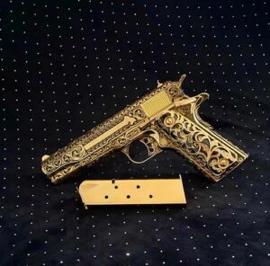 Handgun with gold decorative finish shown in a product image