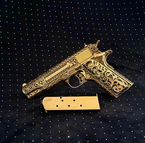 Handgun with gold decorative finish shown in a product image