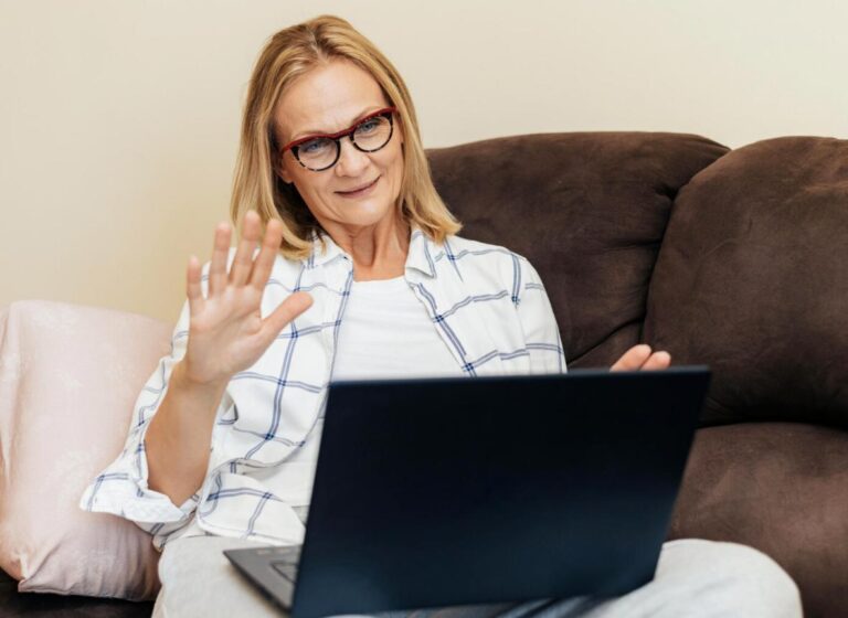 A woman at home engaging in a virtual consultation with a licensed provider