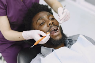 Dentist performing emergency dental treatment