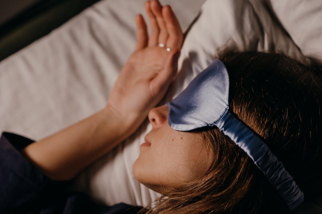A woman wearing a sleep mask