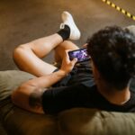 A player competing in sweepstakes gaming on their phone
