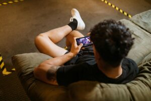 A player competing in sweepstakes gaming on their phone