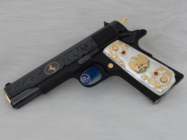 Black customized firearm featuring gold and silver decorative accents with detailed engraving work