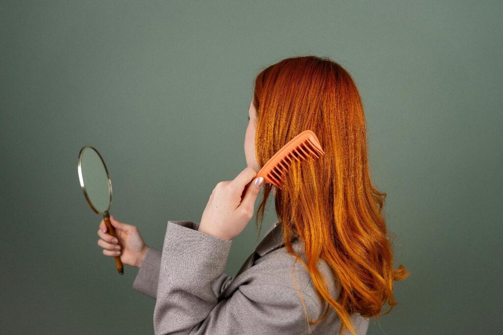 A woman combing her hair