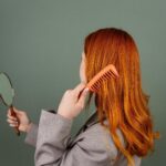 A woman combing her hair