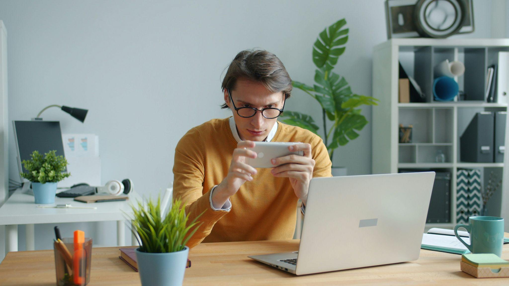 A person playing sweepstakes games on his phone