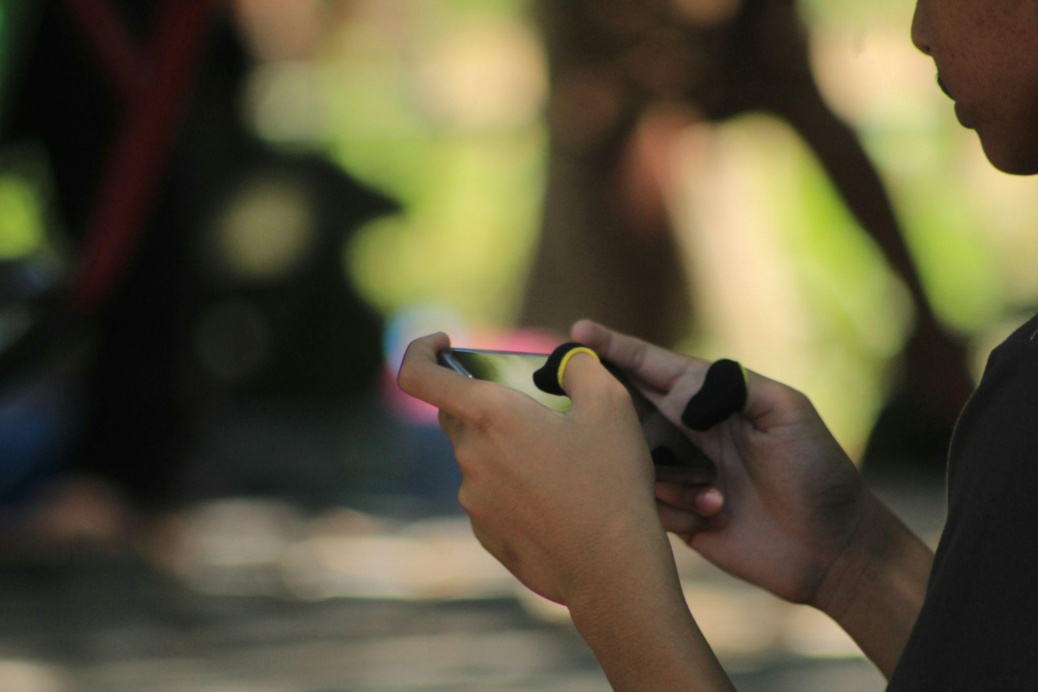 A person playing sweepstakes games on their phone