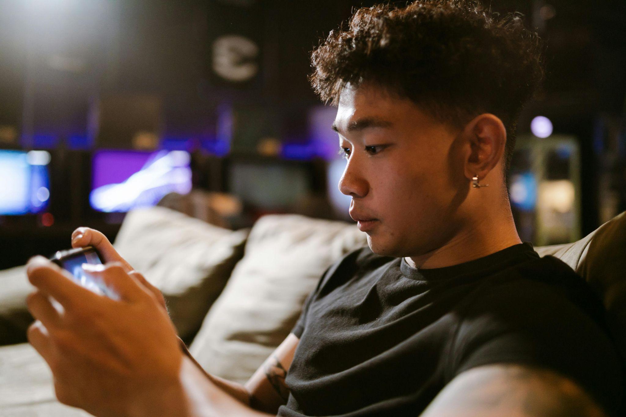 A person playing a game on his phone