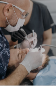 Dentist performing a comprehensive dental checkup on a patient
