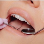 Dentist performing a dental examination using professional dental tools