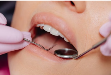 Dentist performing a dental examination using professional dental tools