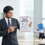 imgi_7_man-suit-standing-office-with-clipboard-pointing-poster-with-words_1098-17121