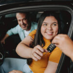Daughter receiving car keys