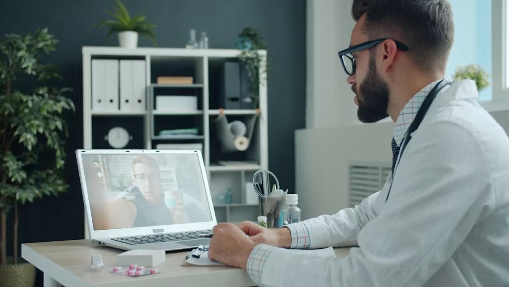 An image of a doctor consulting a patient over video call