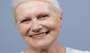 Close-up of an elderly woman smiling with bright, healthy-looking teeth
