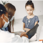 An image of a young girl having a checkup at a clinic