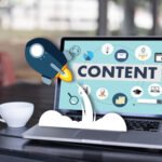 A laptop screen displaying content marketing icons with a rocket graphic popping out, representing growth driven by the best content marketing agencies.