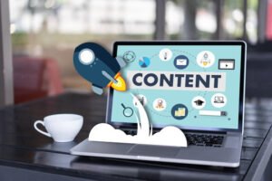 A laptop screen displaying content marketing icons with a rocket graphic popping out, representing growth driven by the best content marketing agencies.