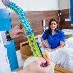 imgi_10_orthopedist-showing-spine-model-patient-hospital_179755-8378