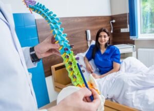 imgi_10_orthopedist-showing-spine-model-patient-hospital_179755-8378