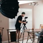 a guy setting up the right angles on his camera.