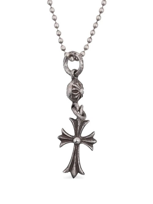 Chrome Heart necklace with iconic cross design in a bold luxury jewelry style.