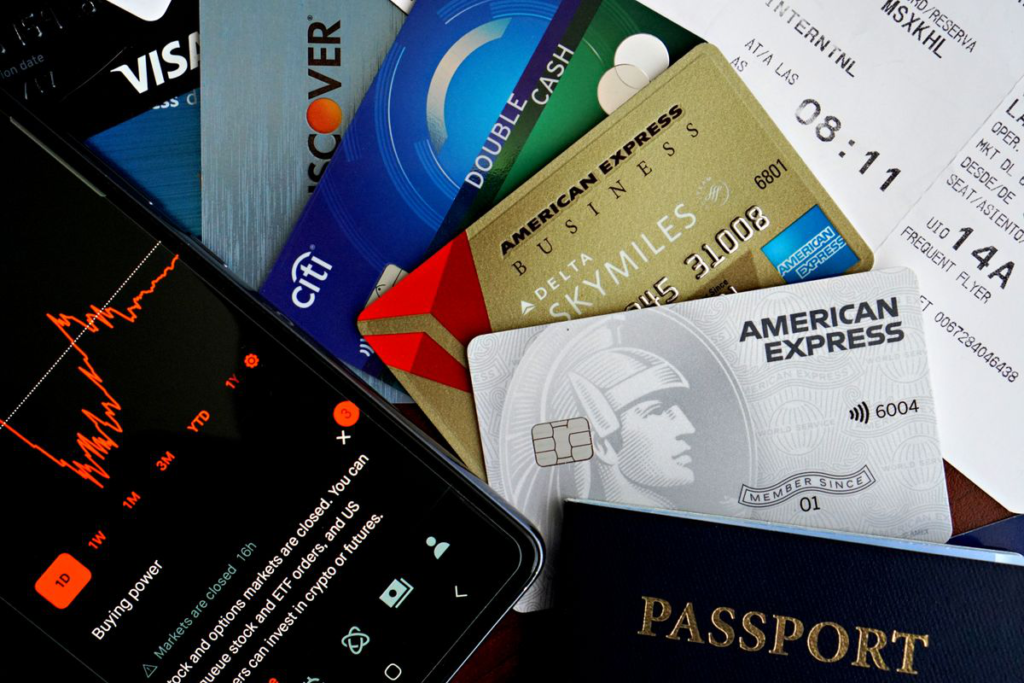 Passport and financial documents arranged flat on a desk