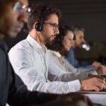 confident-call-center-operator-talking-with-client (1)