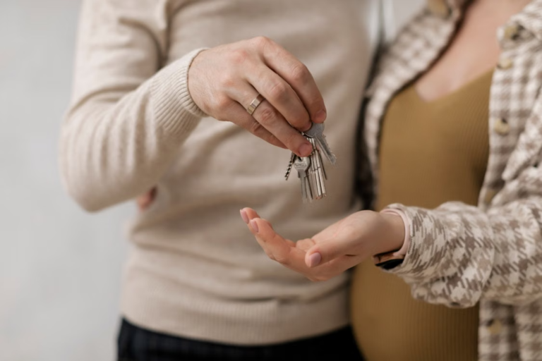 couple holding the keys to their new house