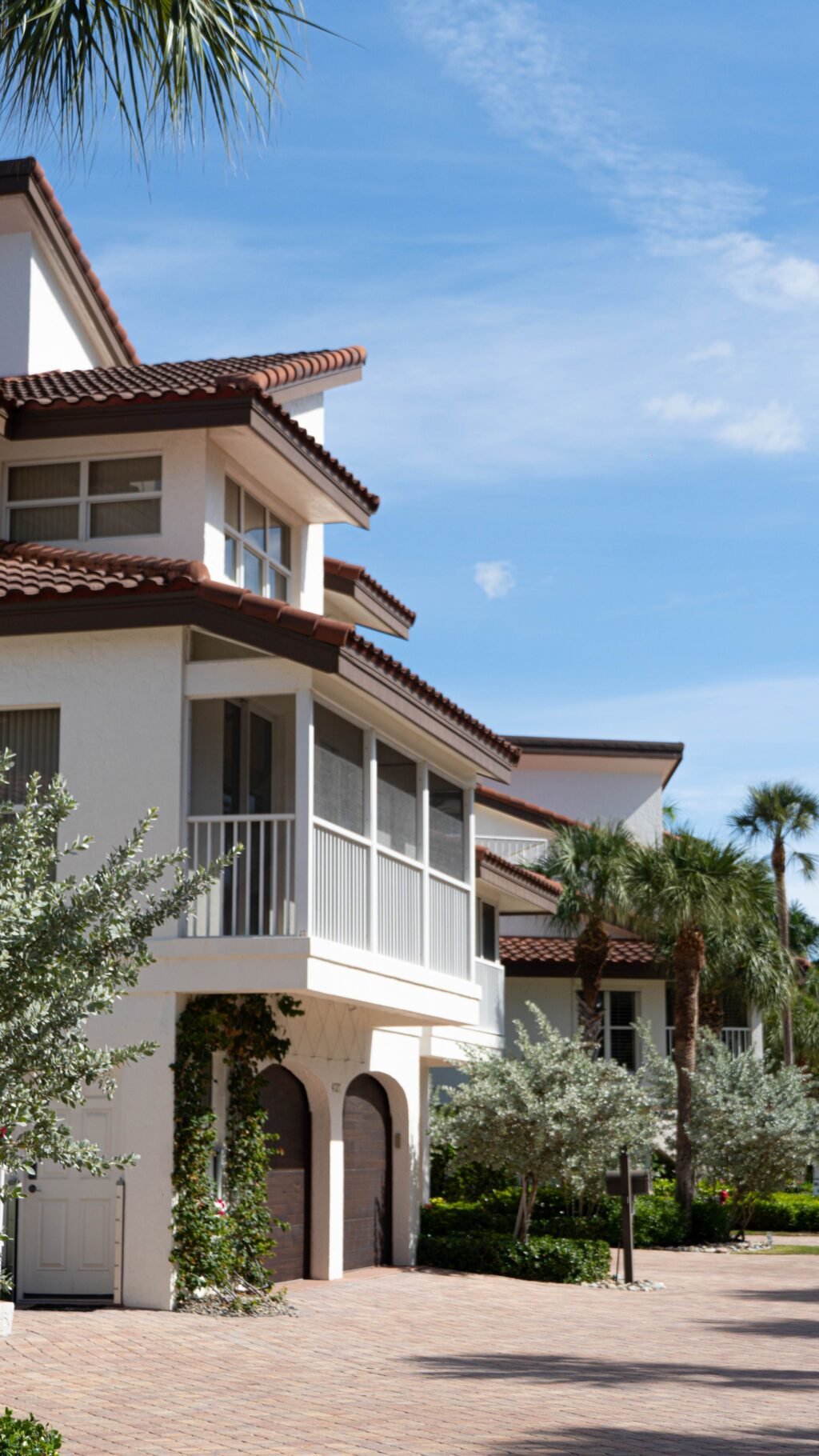 Florida home with palm trees and landscaped exterior