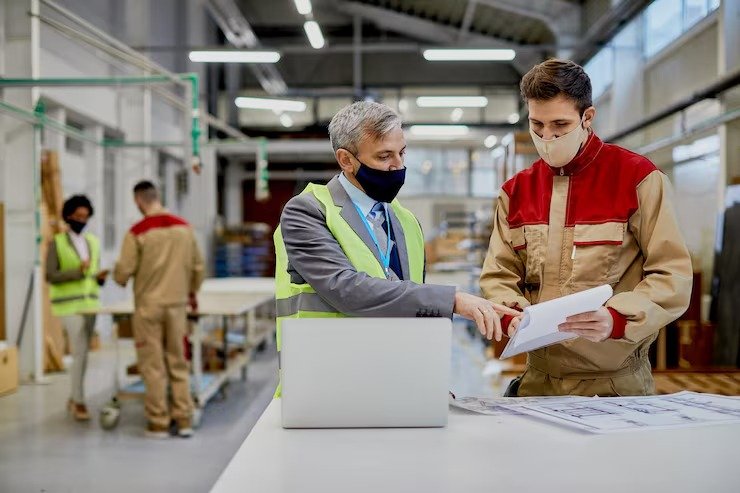 imgi_12_mid-adult-engineer-male-worker-wearing-face-masks-while-examining-paperwork-woodworking-factory_637285-11899