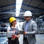 imgi_18_manager-supervisor-worker-discussing-about-production-results-new-strategy-factory-industrial-hall_342744-112