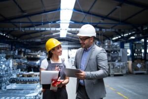imgi_18_manager-supervisor-worker-discussing-about-production-results-new-strategy-factory-industrial-hall_342744-112