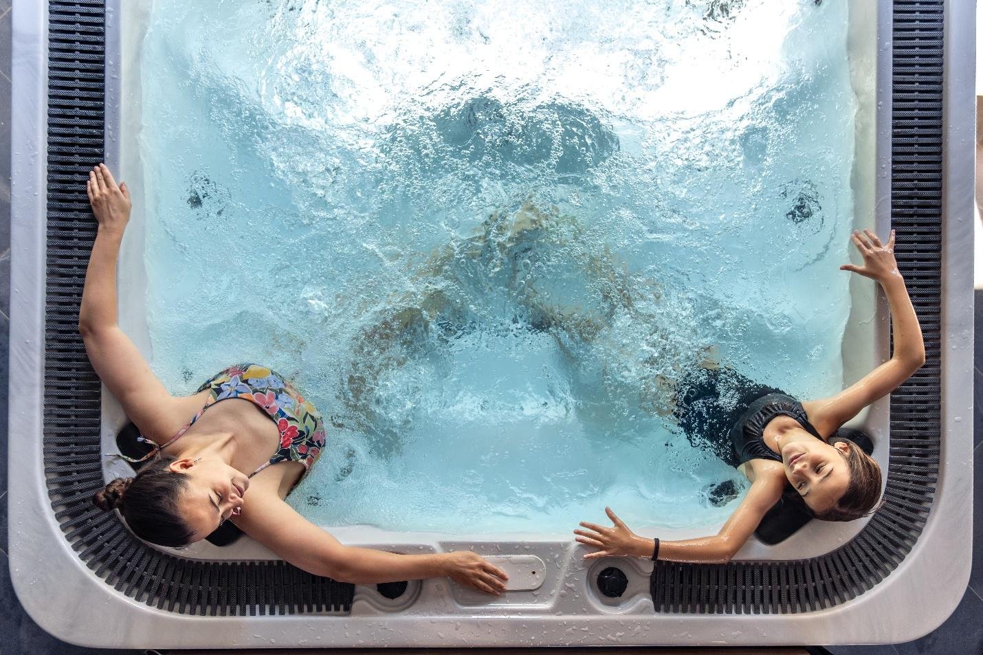 Two women relaxing during a hot tub session
