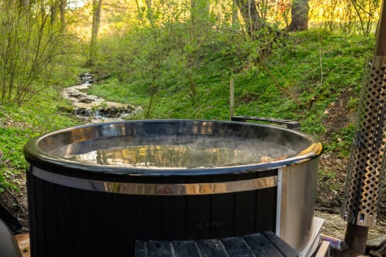 A hot tub set in a quiet backyard surrounded by trees