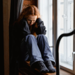 A person sitting by the window