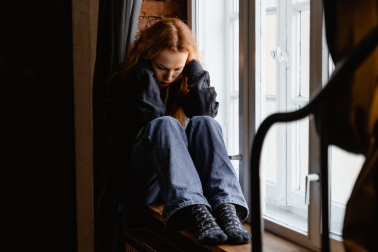 A person sitting by the window