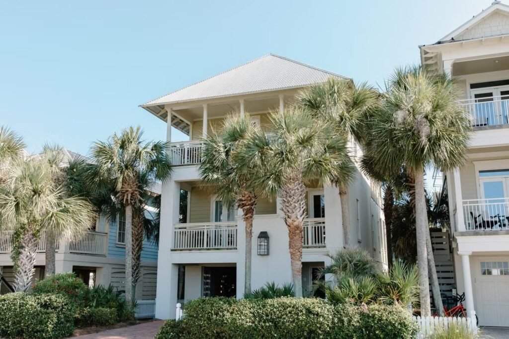 White houses with palm trees growing near them